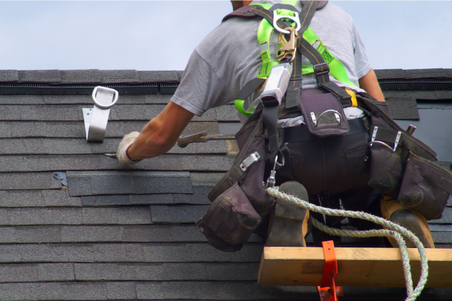 Roof repair construction worker