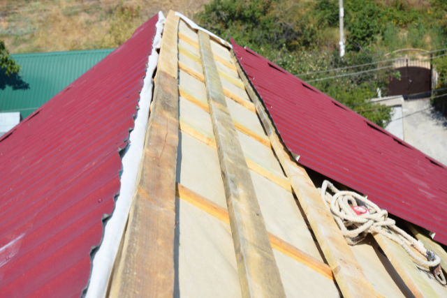 Roofing Contractors Installing House Metal Sheets Roof